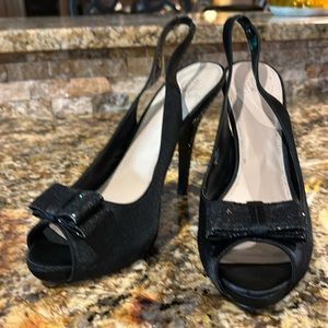 Black satin sling-back heels